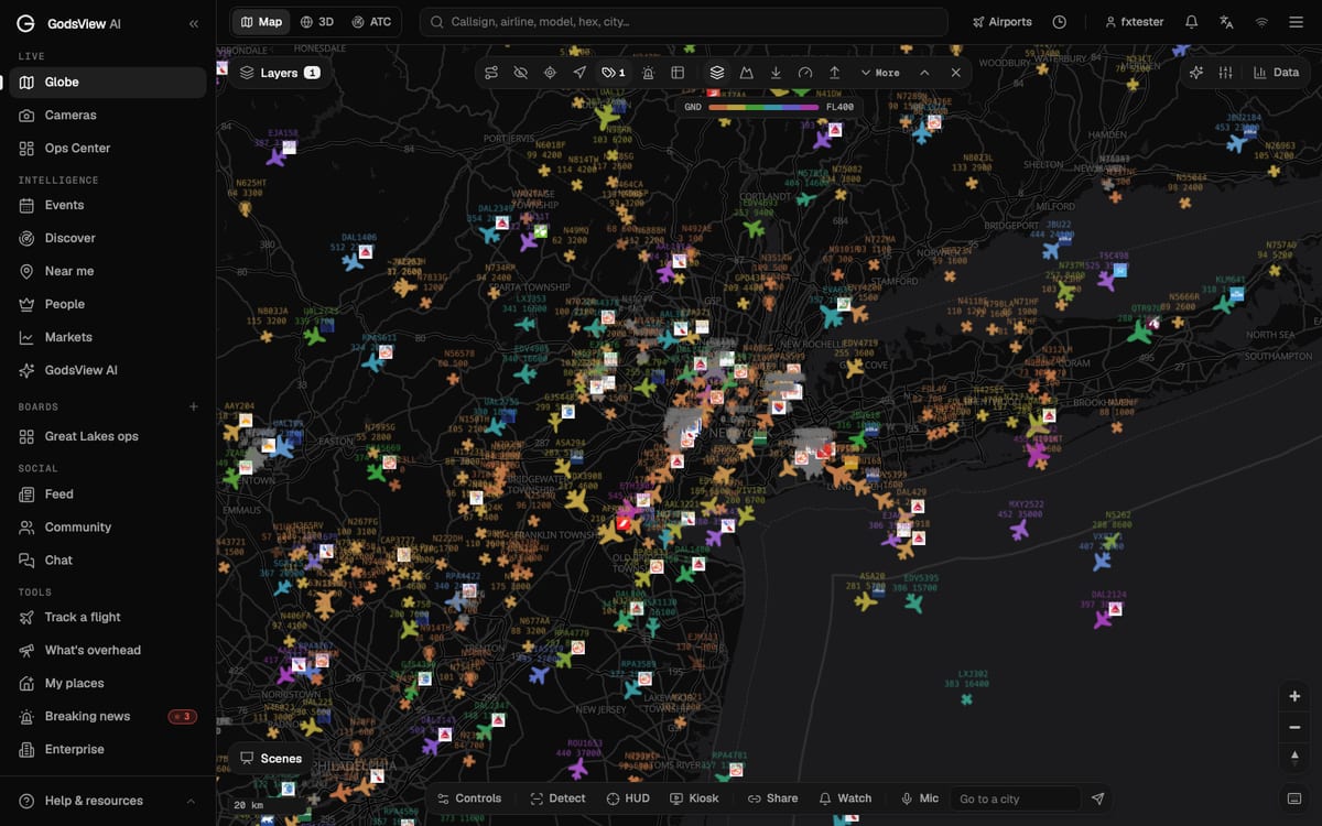Live aircraft over New York and New Jersey on the GodsView map, colored by altitude with callsign and altitude labels